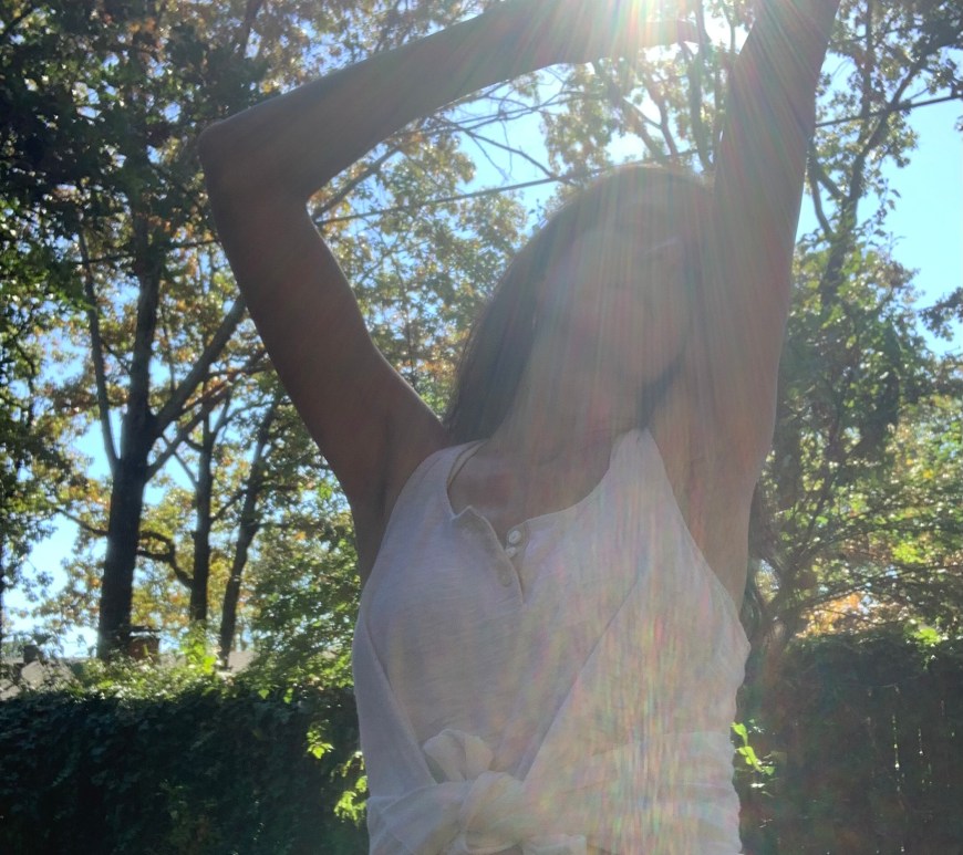 Via dances in the sun surrounded by the sounds trees and a gentle breeze.