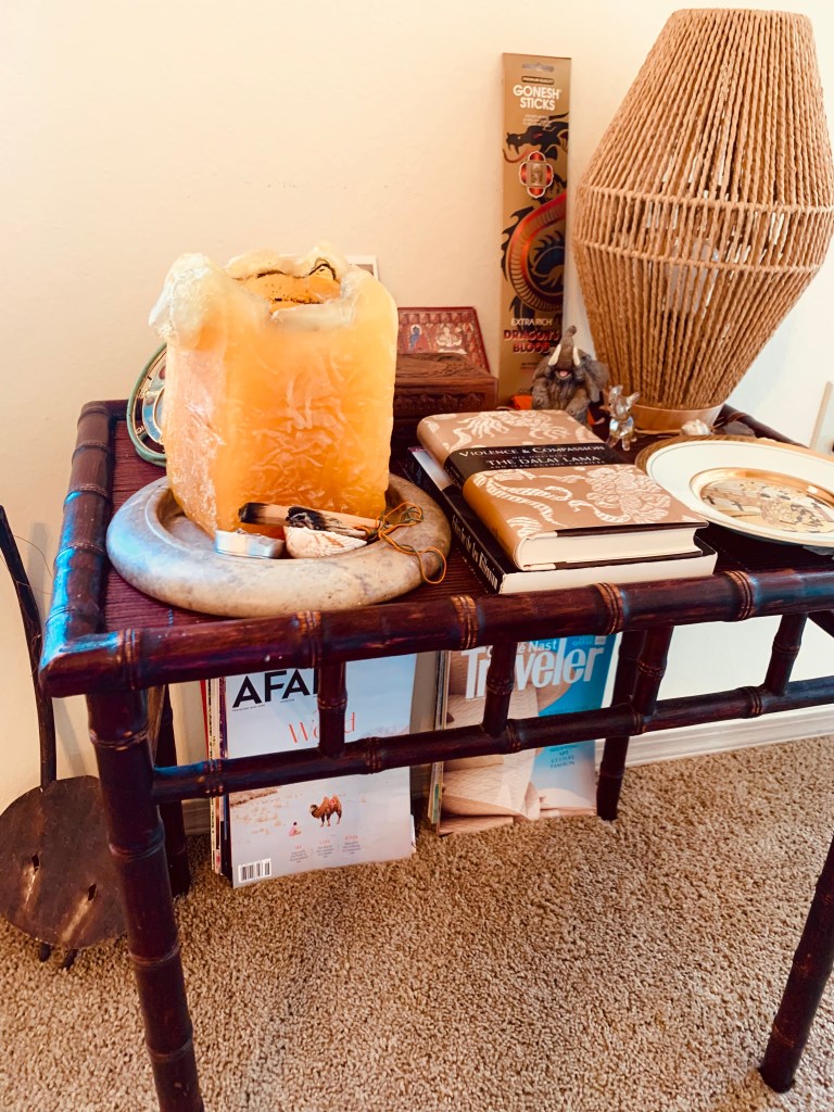 Bamboo table with mango candle and ethnic decor